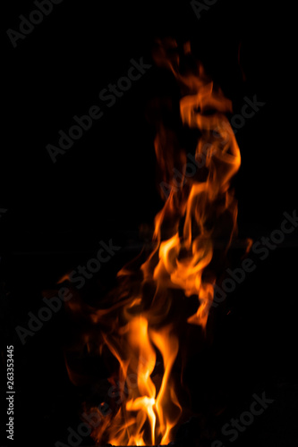 blur of fire on black background. © iHaMoo