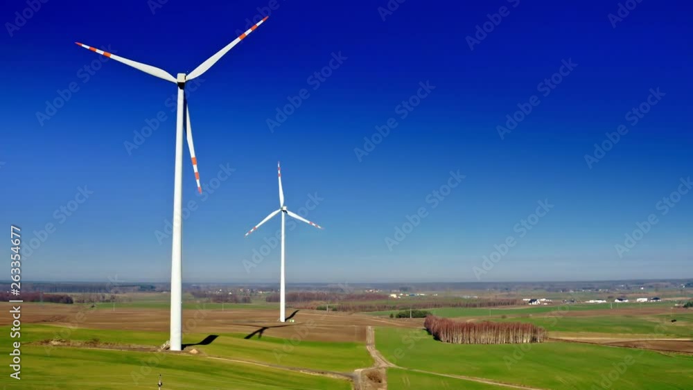 White wind turbines in a field, aerial view, Poland White wind turbines in a field, aerial view, Poland