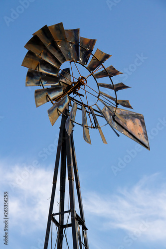 Rustic Windmill with Blue Cloudy Sky