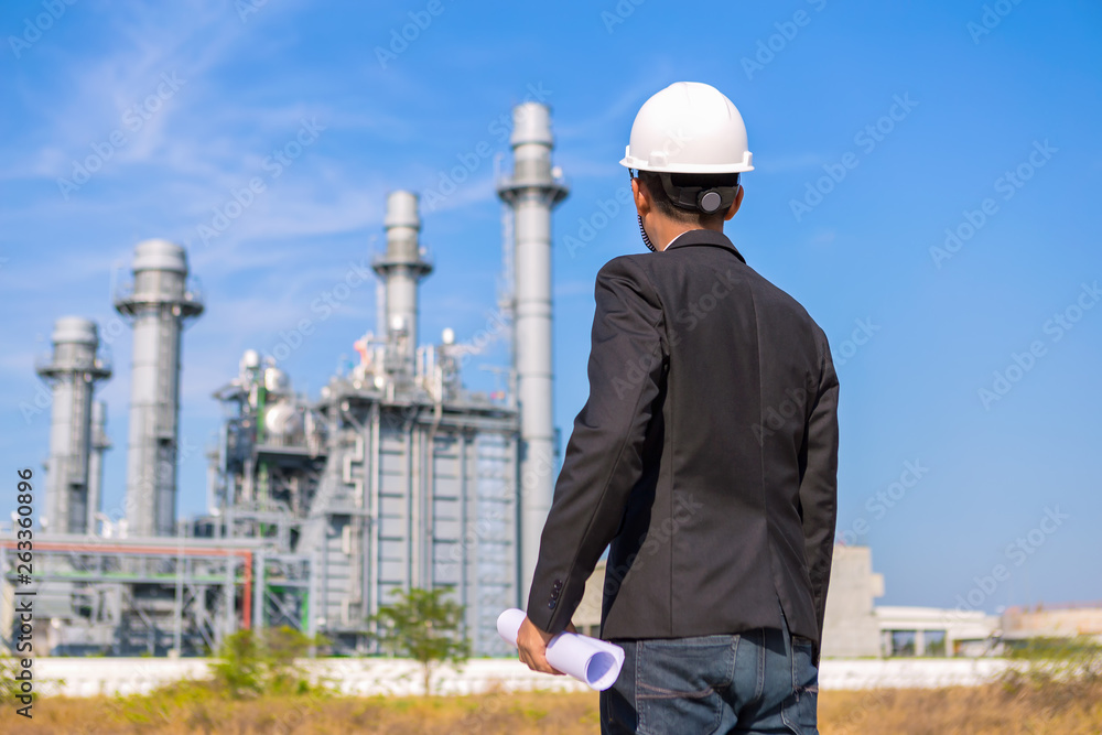 Engineer is checking plant around Gas turbine electrical power plant Engineer is checking plant around Gas turbine electrical power plant