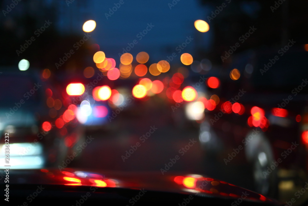 car driving on night road city, blur light traffic background