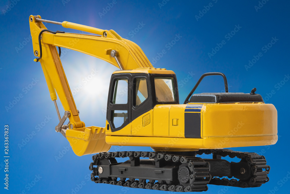 Excavator loaders on  a  sunlight and blue sky background