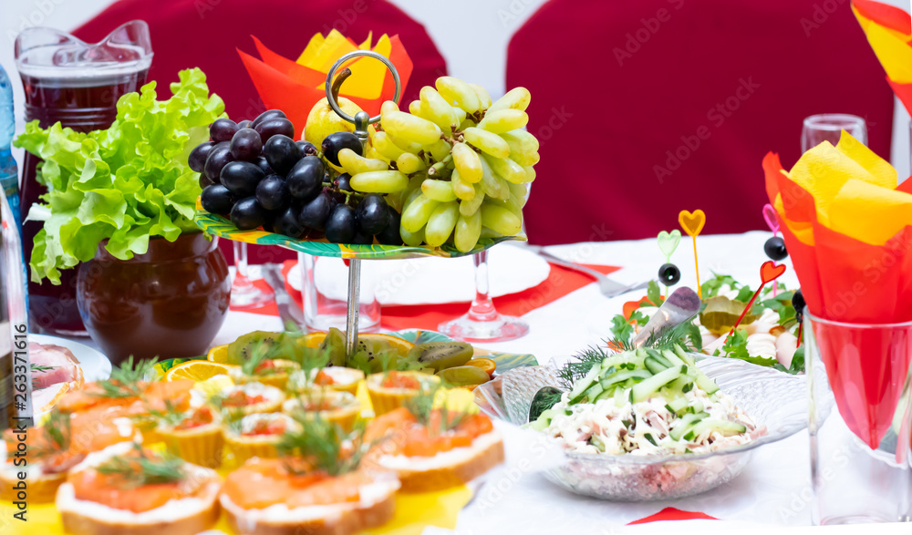 Laid table with fruit and drinks. Holiday. Horizontal orientation Laid table with fruit and drinks. Holiday. Horizontal orientation