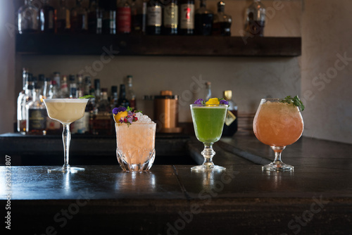 Summer cocktails lined up on the bar counter