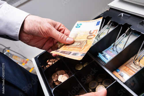 Euro Banknotes And Coins In Cash Box photo