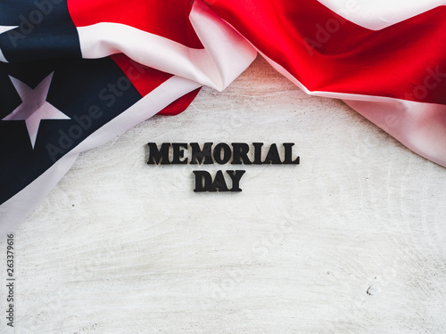 Beautiful card for the Memorial Day. Wooden letters with a congratulatory inscription on a white background. Close-up, top view. Congratulations for loved ones, relatives, friends and colleagues