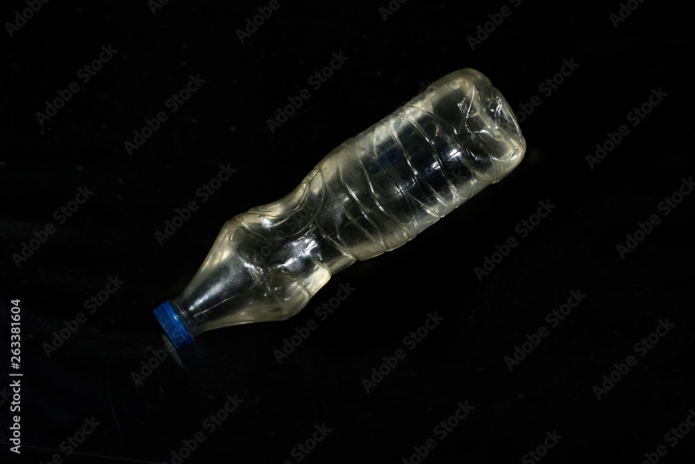 Plastic water bottle isolated on black background Plastic water bottle isolated on black background