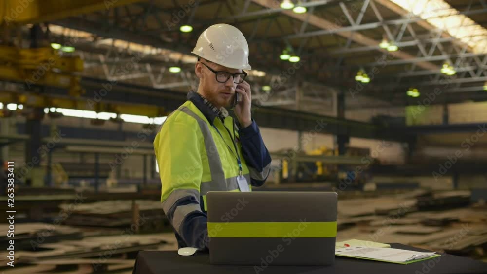 technologist engineer talking on the phone at the workplace technologist engineer talking on the phone at the workplace