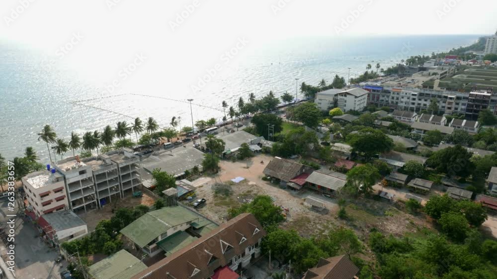 Locked wide aerial panoramic time-lapse shot of Pattaya Beachfront from an elevated point with ocean view. Bright sunshine and ocean view holiday atmosphere Locked wide aerial panoramic time-lapse shot of Pattaya Beachfront from an elevated point with ocean view. Bright sunshine and ocean view holiday atmosphere