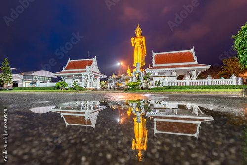 A golden buddha statue on the mountain top at Hat Yai municipality public park, Songkhla Province, Thailand photo