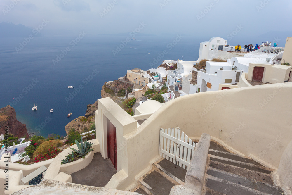 Panorama of the village of Oia and the caldera on a rare rainy day