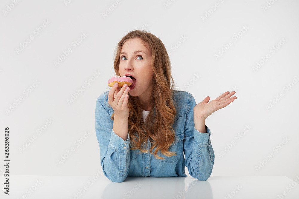Photo of young pretty woman which is going to bite off a delicious kidney, isolated over white background. Photo of young pretty woman which is going to bite off a delicious kidney, isolated over white background.