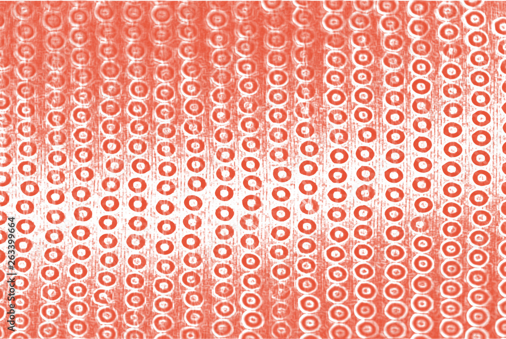 Red sequins on shining background, abstract backdrop for bright banner, modern coral color.