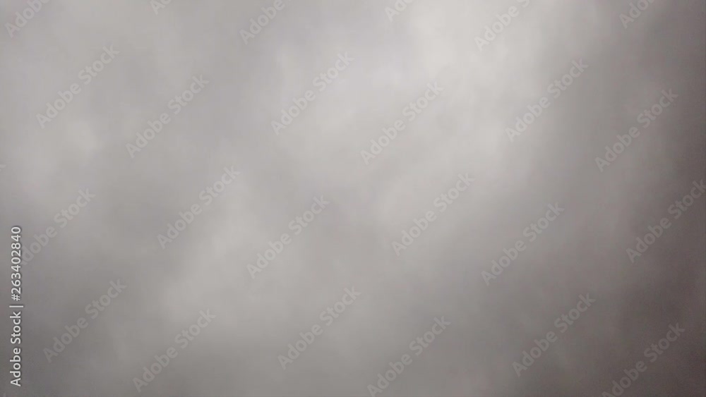 Timelapse sky with dense gray nimbostratus clouds blow like smoke in ominous sky Timelapse sky with dense gray nimbostratus clouds blow like smoke in ominous sky