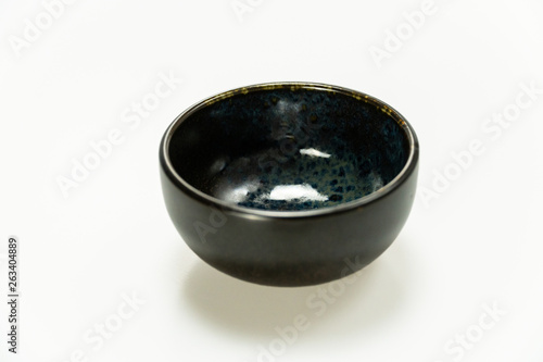circle ceramic bowl with indigo blue pattern isolated on white background