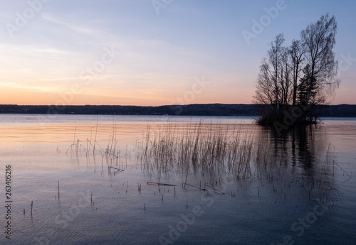 Fototapeta Naklejka Na Ścianę i Meble -  Small island in a lake at sunset