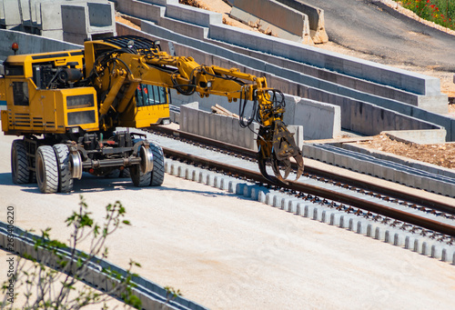 Rail excavator on reconstruction of the railway rails photo