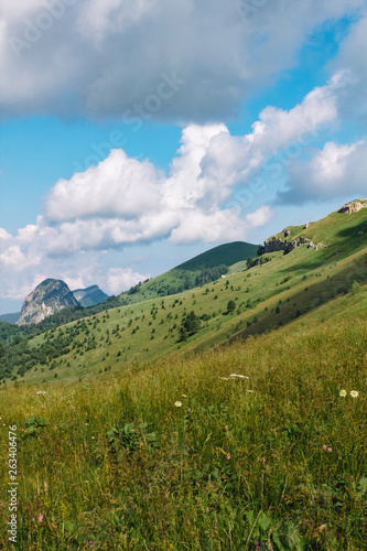 Beautiful summer mountain landscape with clouds and a sunny day.