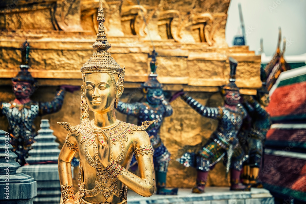 Golden Kinnara Statue at Emerald Buddha temple in Grand Palace of Bangkok