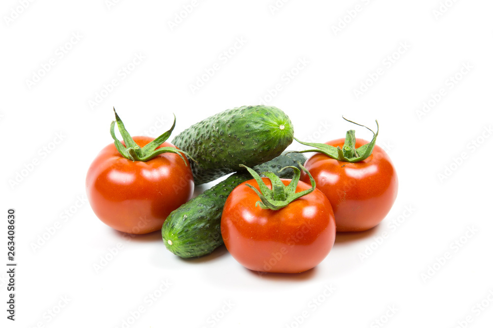Fresh red tomatoes and cucumbers isolated on white background Food and drink Agriculture Fresh red tomatoes and cucumbers isolated on white background Food and drink Agriculture