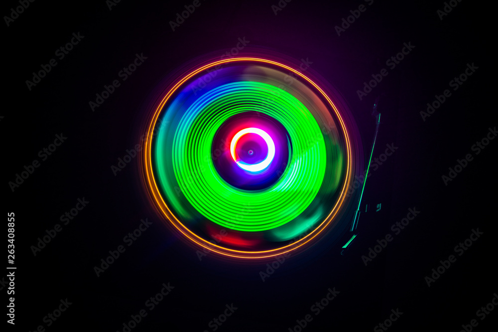 Concept of speed - Trail of fire and smoke - Vinyl record. Burning vinyl disk. Turntable vinyl record player. Retro audio equipment for disc jockey. Sound technology Concept of speed - Trail of fire and smoke - Vinyl record. Burning vinyl disk. Turntable vinyl record player. Retro audio equipment for disc jockey. Sound technology