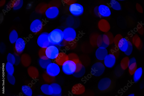 Blue and red bokeh on black background