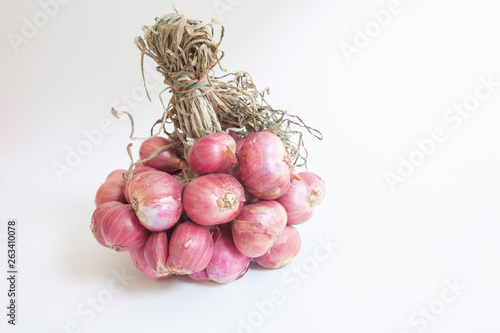 Whole bunch of Shallot is a Thai herb and cooking ingredients isolated on white background.