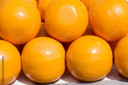 close up pile of yellow cheese balls on the market in Holland