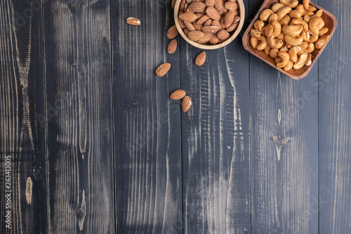 almond and Cashew nut on wooden bowl