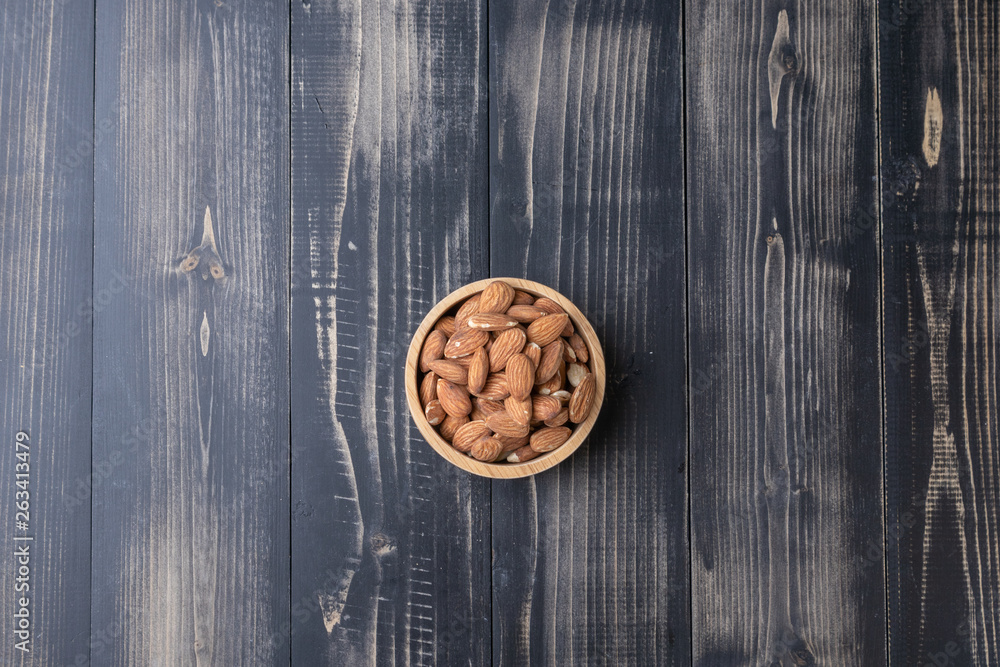 close up of almond on wooden plate close up of almond on wooden plate
