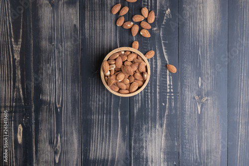 close up of almond on wooden plate