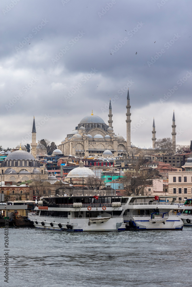 Cityscape of Golden horn with ancient and modern buildings at Bosphorus strait in Istanbul Turkey with background of Suleymaniye mosque