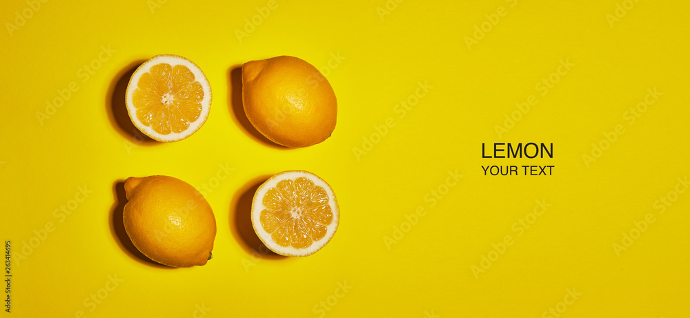 Creative layout made of lemon on yellow background. Flat lay, top view, copy space . Food concept.
