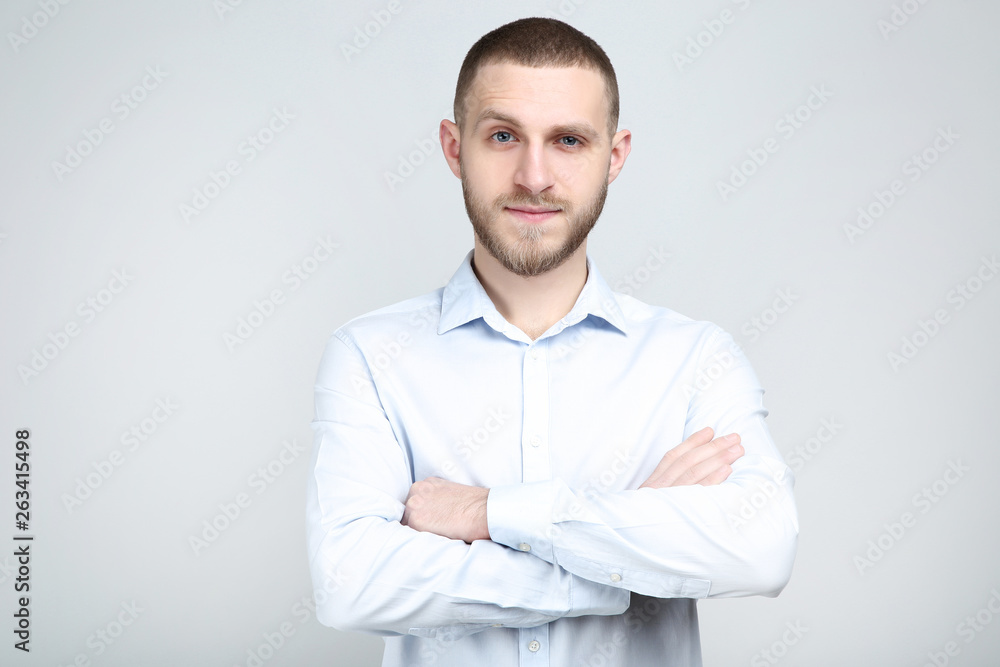 Portrait of young man on grey background Portrait of young man on grey background