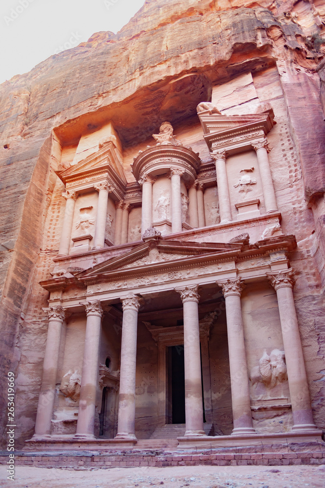 Petra, Jordan. Al Khazneh - the treasury, ancient city of Petra, Jordan. Nabatean rock-cut temple of Hellenistic period of ancient Petra, originally known to Nabataeans as Raqmu - historical city Petra, Jordan. Al Khazneh - the treasury, ancient city of Petra, Jordan. Nabatean rock-cut temple of Hellenistic period of ancient Petra, originally known to Nabataeans as Raqmu - historical city