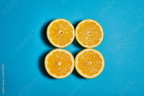 Lemon on blue background. Flat lay  top view  copy space . Food concept.