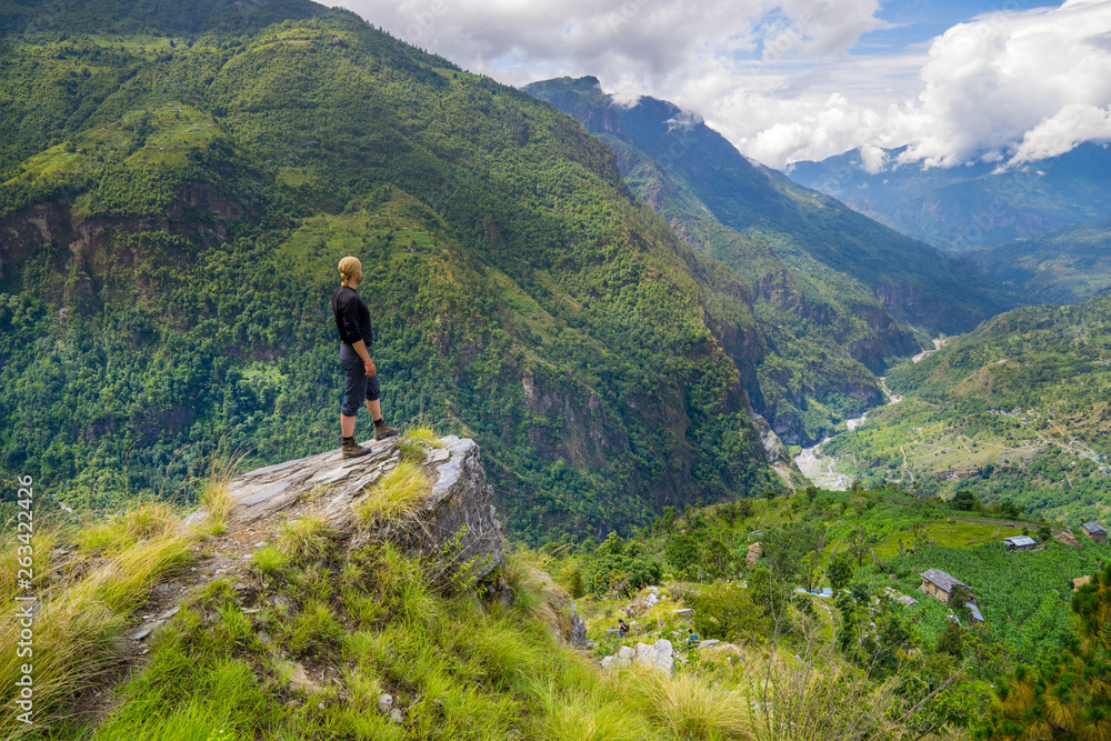 Man standing on hill top in Himalayas