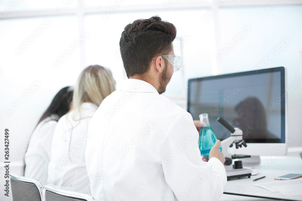 Fototapeta premium rear view.a group of scientists working in a modern laboratory