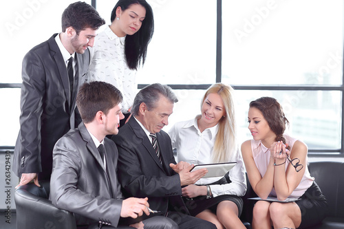 businessman and business team using digital tablet