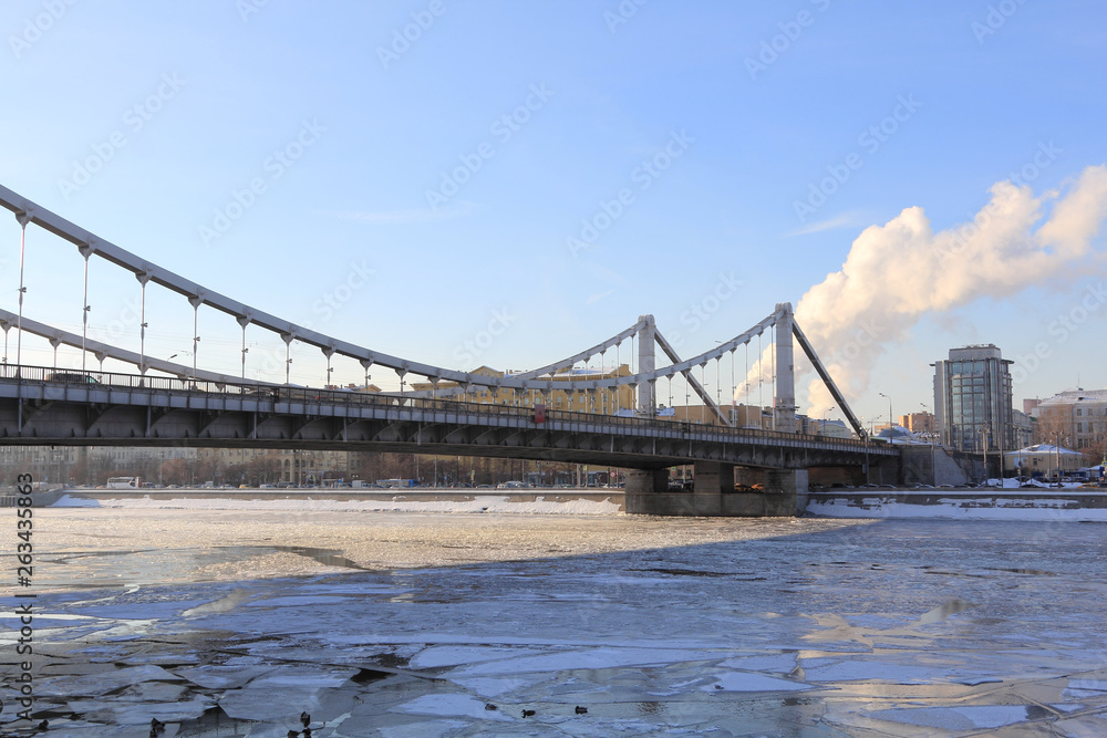 Krymsky Bridge in Moscow in winter. Bridges are great workers. On the river now neither swim nor cross the river on foot. But the bridge brilliantly solves this problem for people. 