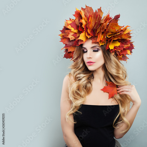 Sexy woman portrait. Beautiful model with makeup and healty curly hair