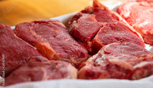 Beef steak cooking. Rib eye steak. Raw meat. Juicy marbled meat on BBQ grill. Medium rare meat roasting