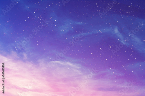View on a evening purple sky with cirrus clouds and stars (background, abstract)