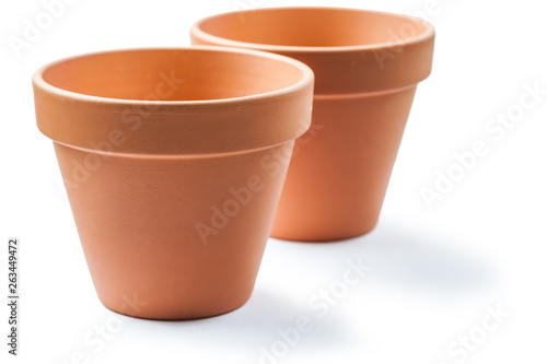 two clay brown pots isolated on white
