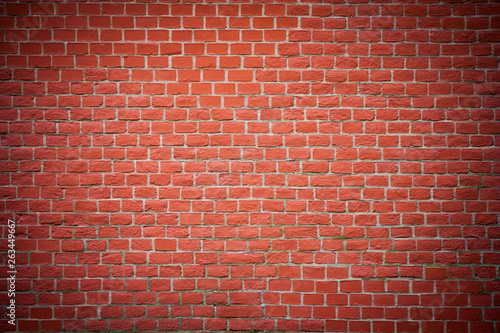 Red brick wall with vignette as texture  background