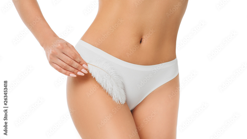 woman touching with feather her genitals wearing panties , showing