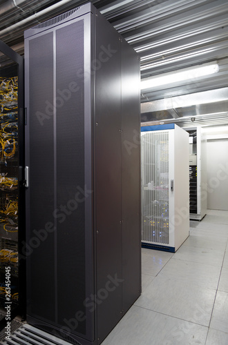 Fototapeta Naklejka Na Ścianę i Meble -  Grey and white server cases in datacenter modern server room