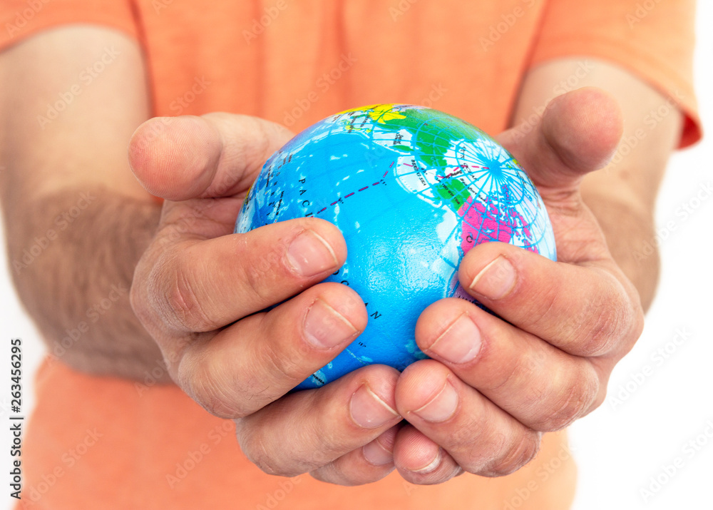 Hand of the person holds globe Hand of the person holds globe