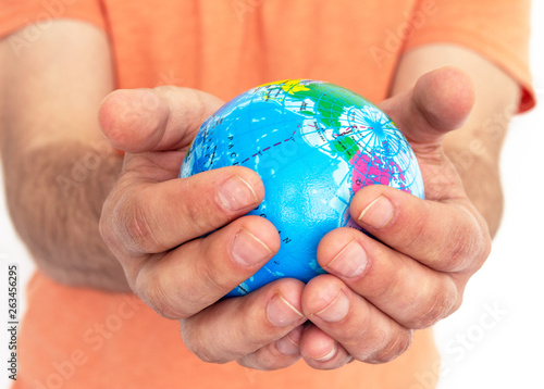 Hand of the person holds globe