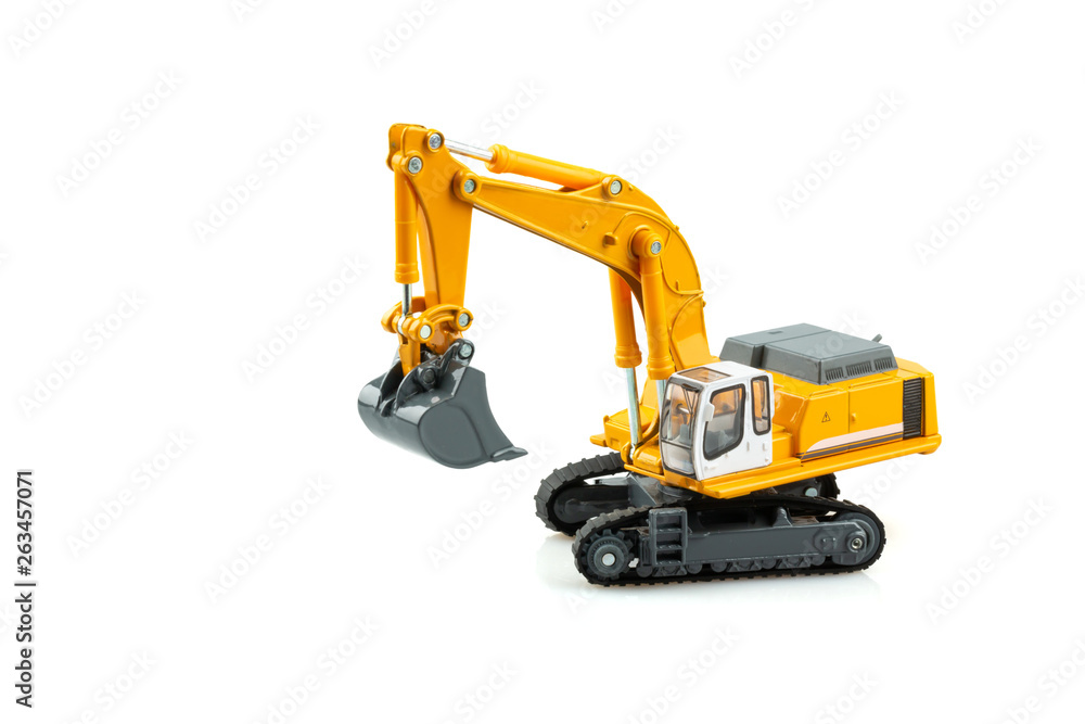 Yellow excavator model toy isolated on white background. Yellow excavator model toy isolated on white background.